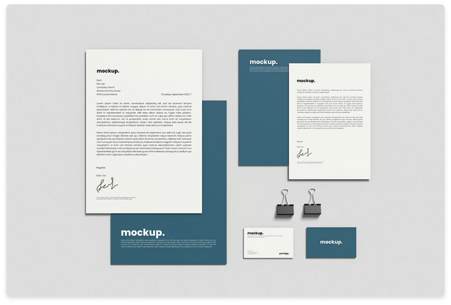 A professional branding mockup displaying stationery items, including letterheads, business cards, folders, and binder clips. The design features a minimalist and modern style with a white and deep blue color scheme, showcasing a cohesive corporate identity layout.
